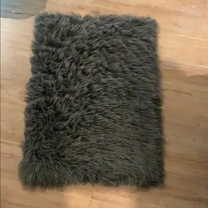 Small grey furry rug